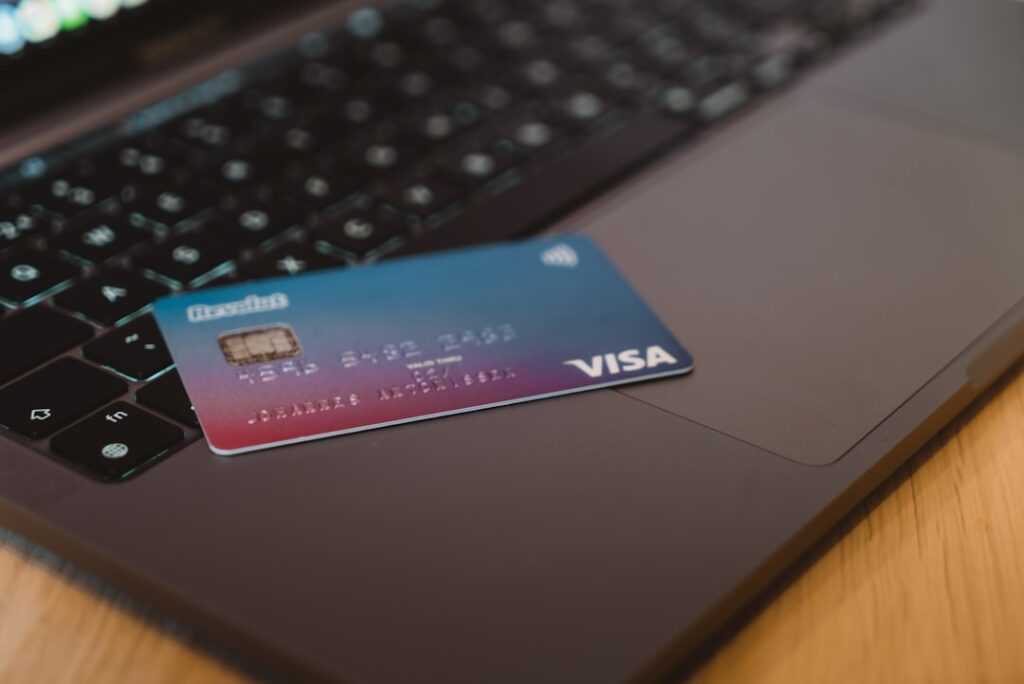 Digital Visa card on laptop representing corporate expense management