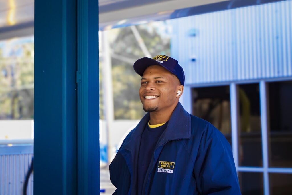 Service technician in blue uniform representing blue-collar AI opportunity