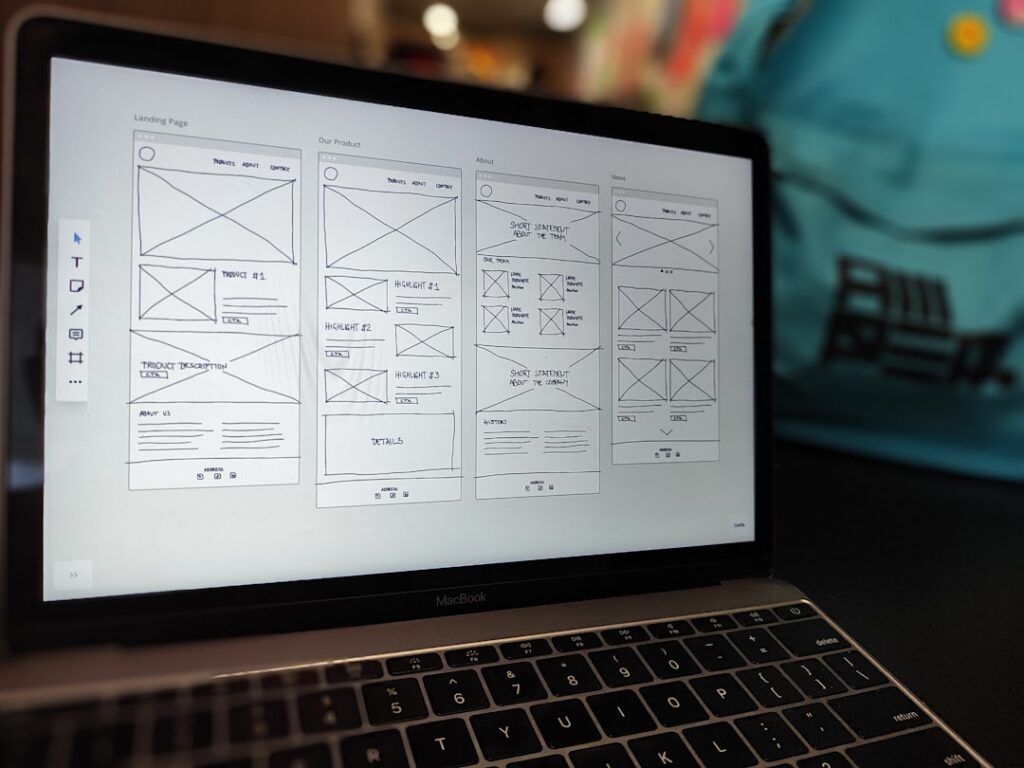 Laptop showing UI design and prototyping interface