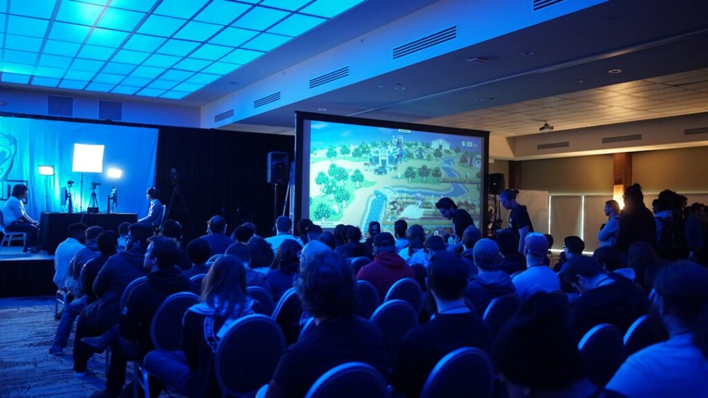 Audience attending a tech conference keynote presentation