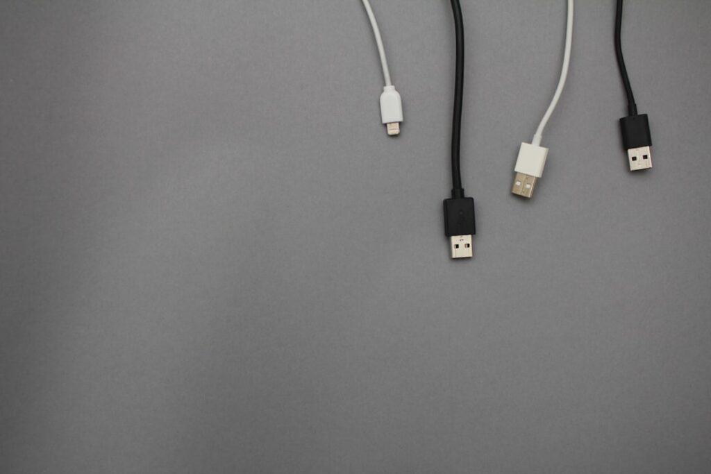 Different charging cables and USB connectors representing technology interoperability