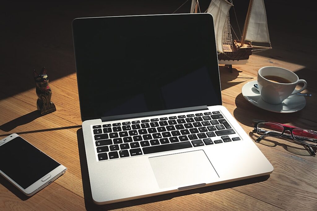 Notebook and smartphone on a clean organized desk workspace